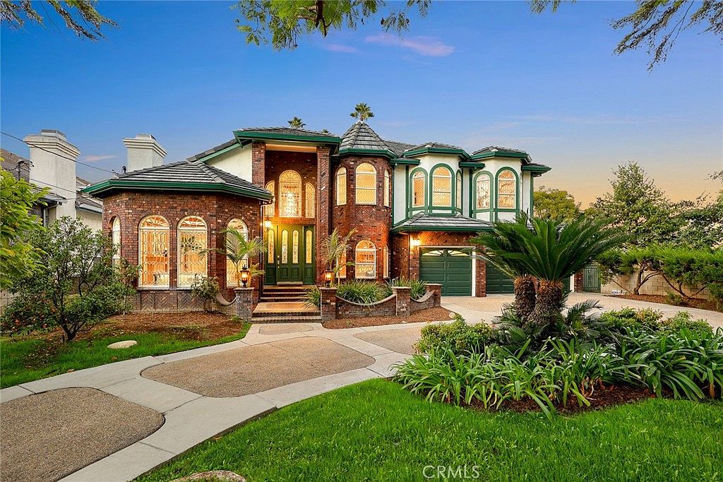 Grand foyer with spiral staircase and crystal chandelier