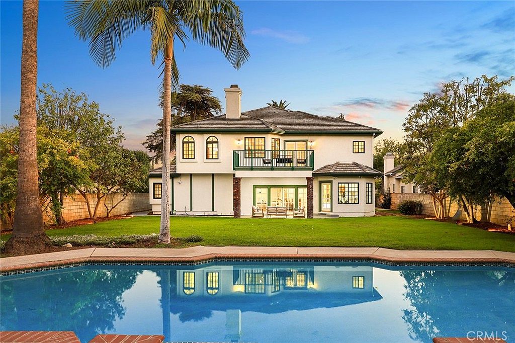 Primary bathroom with dual sinks and stone counters